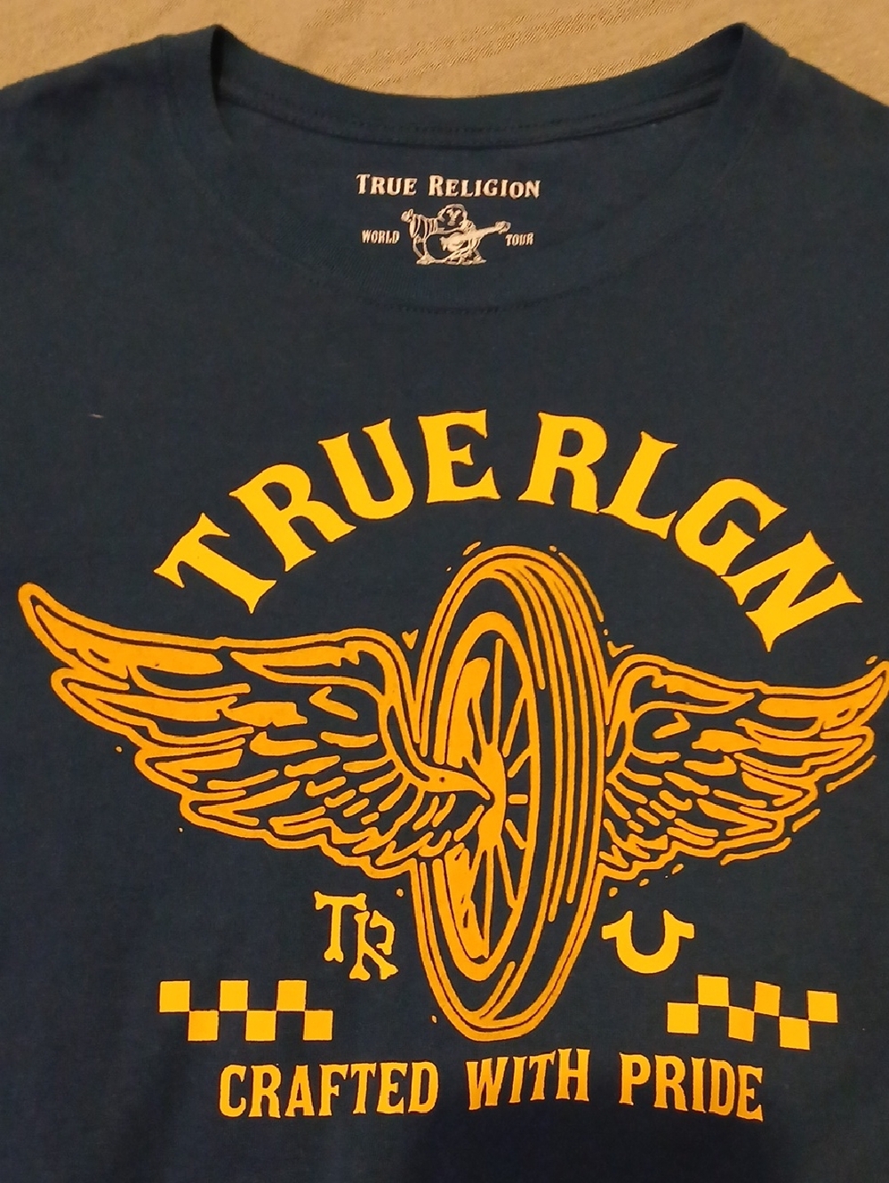 True Religion Navy Tee with Yellow Winged Wheel Graphic